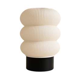 Lámpara KLÉIA encendida, diseño escultórico en 3D, luz cálida ambiental, color blanco marfil con base negra, marca ARKHITA